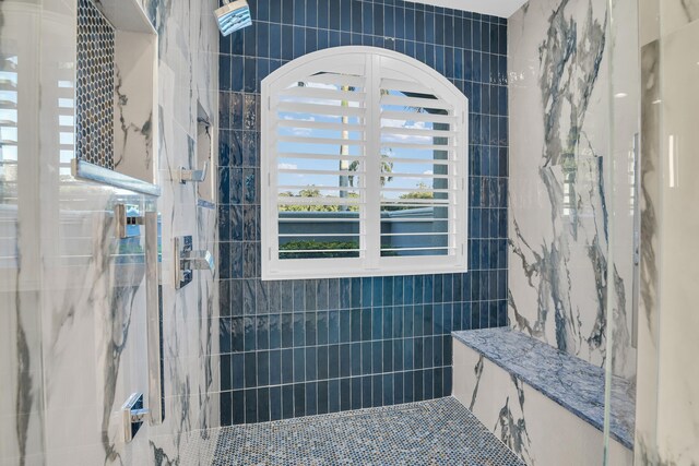 bathroom with a soaking tub, marble finish floor, a sink, and recessed lighting