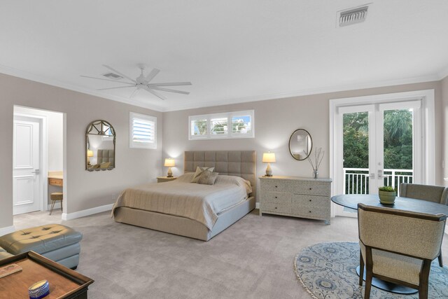 bedroom featuring arched walkways, light colored carpet, ornamental molding, a ceiling fan, and baseboards