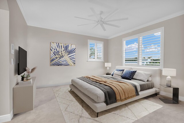 workout area featuring ornamental molding, light colored carpet, and ceiling fan