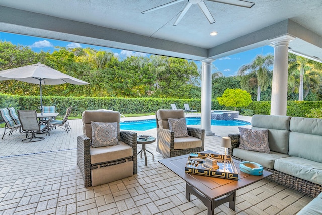 view of patio with a pool with connected hot tub, outdoor lounge area, ceiling fan, and outdoor dining area