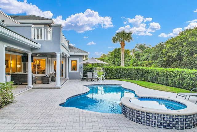 view of pool featuring a fenced in pool, a patio, an outdoor hangout area, an in ground hot tub, and fence