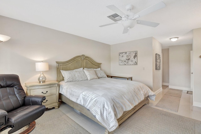 bedroom featuring ceiling fan and light tile patterned flooring