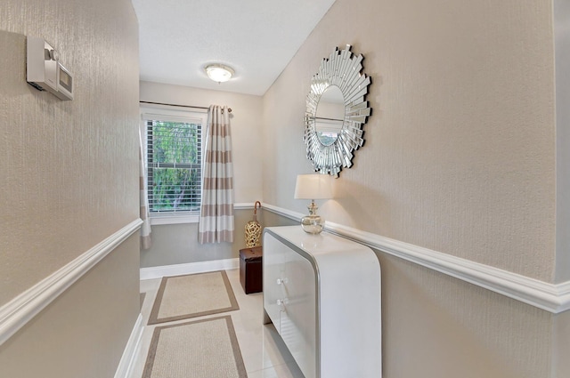 laundry area featuring light tile patterned floors