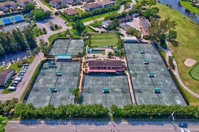 birds eye view of property with a water view