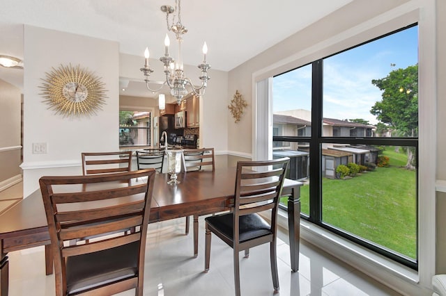 dining space featuring an inviting chandelier