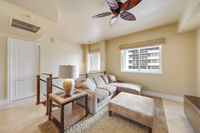 living room featuring light colored carpet and ceiling fan