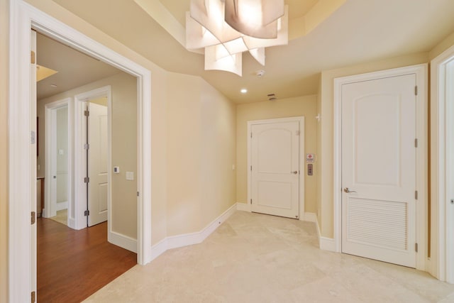 hall with light hardwood / wood-style floors