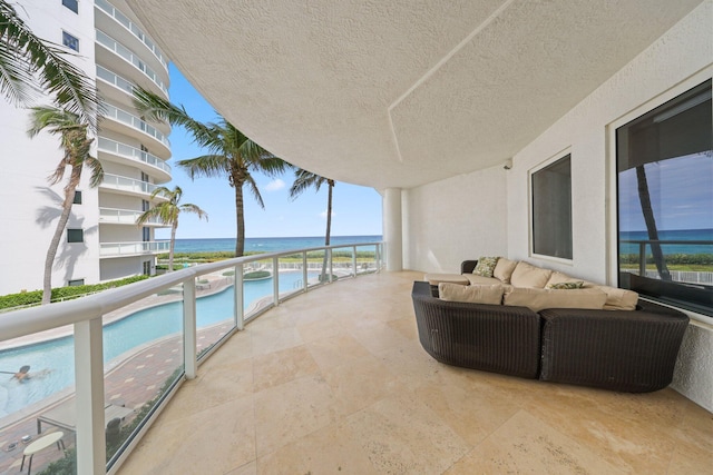 balcony featuring a water view