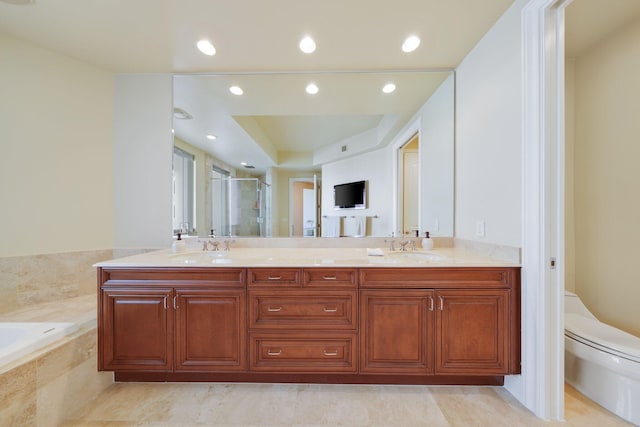 full bathroom with vanity, toilet, and independent shower and bath