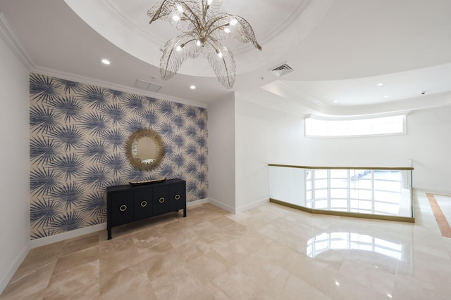 interior space with a raised ceiling and ornamental molding