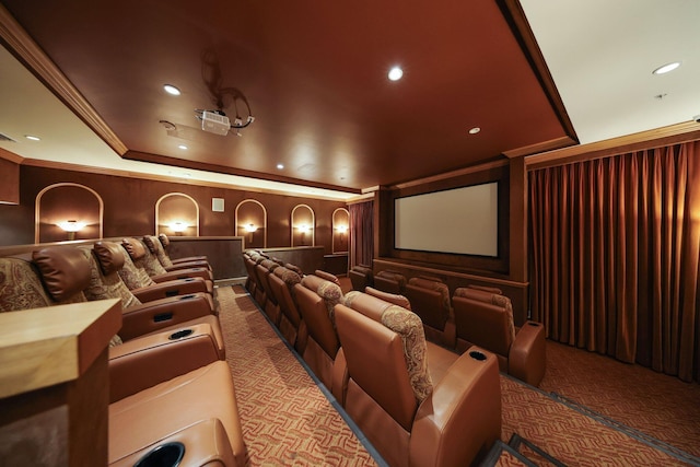 cinema with carpet floors and crown molding