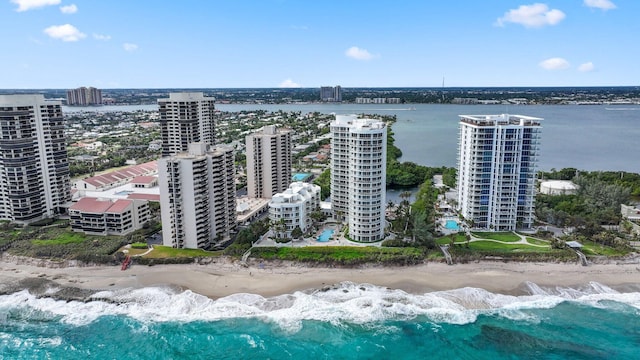 birds eye view of property featuring a water view and a view of the beach