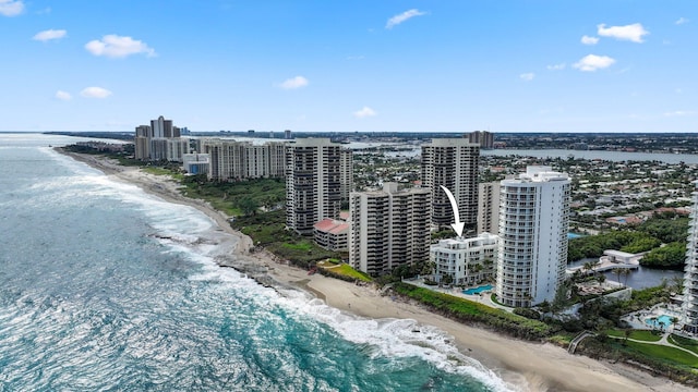 birds eye view of property featuring a view of the beach and a water view