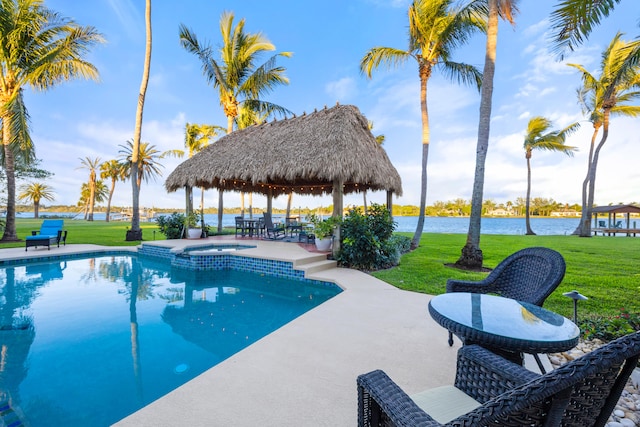 view of pool featuring a lawn, a water view, a gazebo, an in ground hot tub, and a patio area