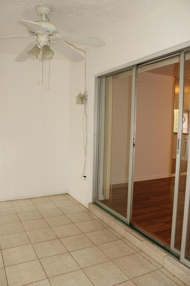 unfurnished room with ceiling fan and light wood-type flooring