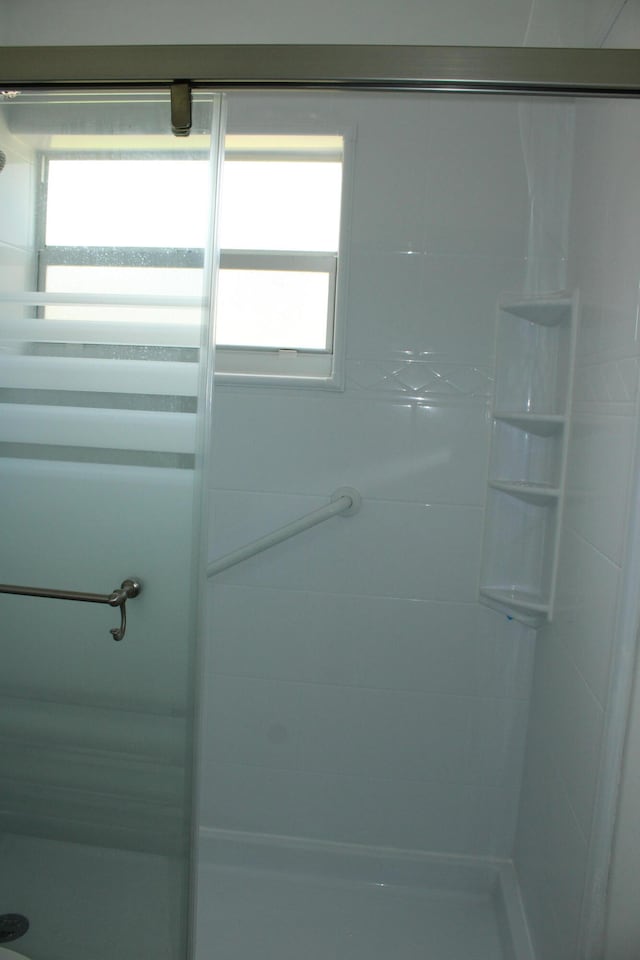 bathroom with a tile shower