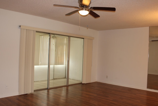 unfurnished bedroom with a textured ceiling, ceiling fan, and dark wood-type flooring