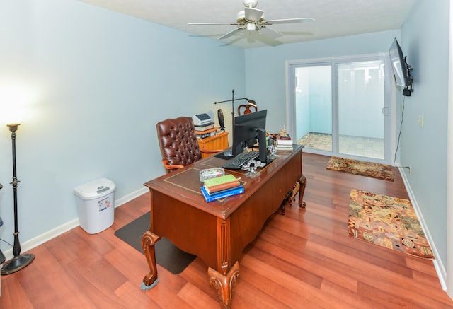 office area with ceiling fan and light hardwood / wood-style floors