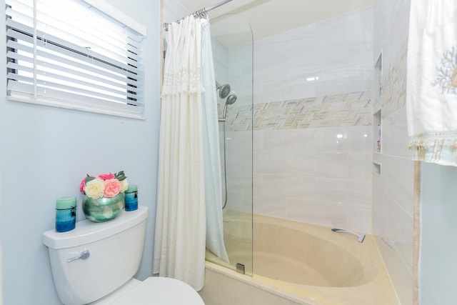 bathroom featuring toilet and shower / bath combo with shower curtain