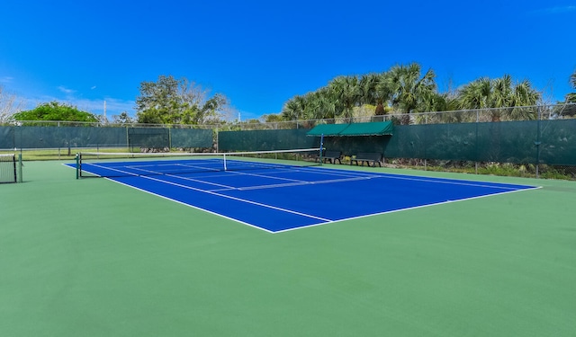 view of tennis court featuring basketball court