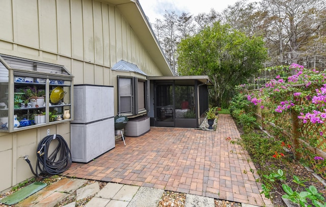 view of patio / terrace featuring a sunroom