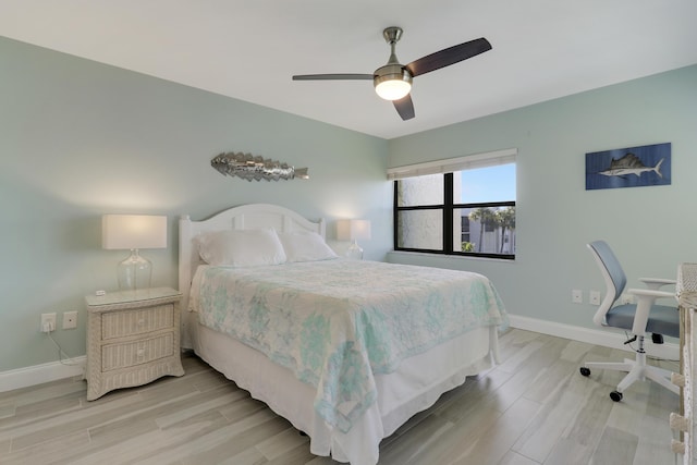 bedroom featuring ceiling fan and light wood-type flooring