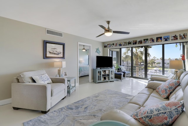 tiled living room with ceiling fan