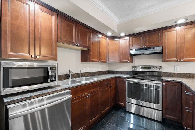 kitchen featuring sink, dark stone countertops, ornamental molding, a textured ceiling, and stainless steel appliances