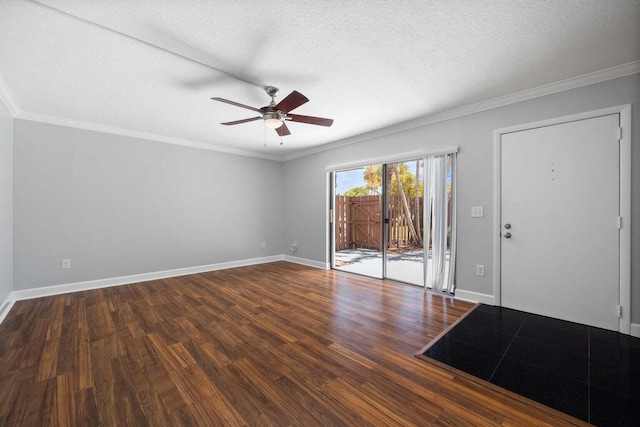 foyer with ceiling fan, crown molding, dark wood-type flooring, and a textured ceiling