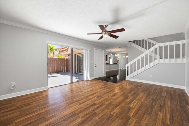 unfurnished living room featuring hardwood / wood-style floors, ceiling fan with notable chandelier, crown molding, and a textured ceiling