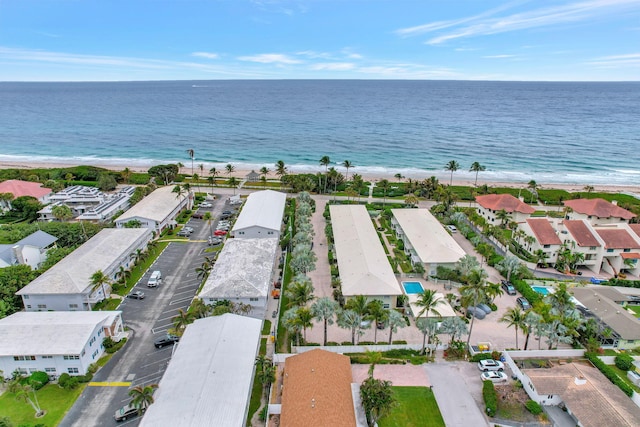 bird's eye view with a water view and a view of the beach