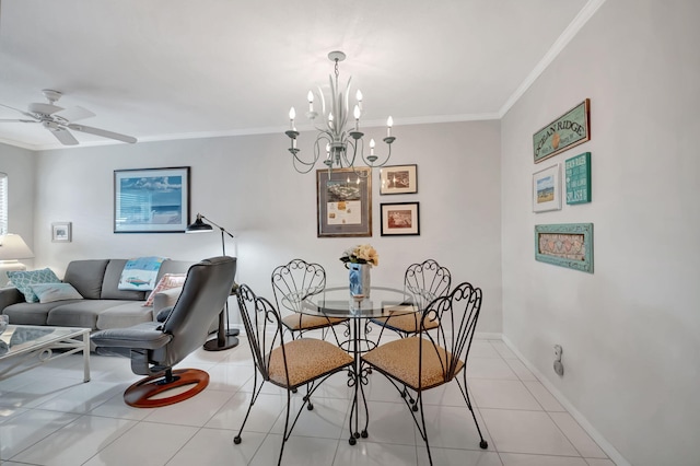 tiled dining space featuring ceiling fan with notable chandelier and crown molding