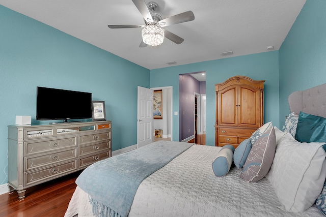 bedroom featuring ceiling fan and dark hardwood / wood-style floors