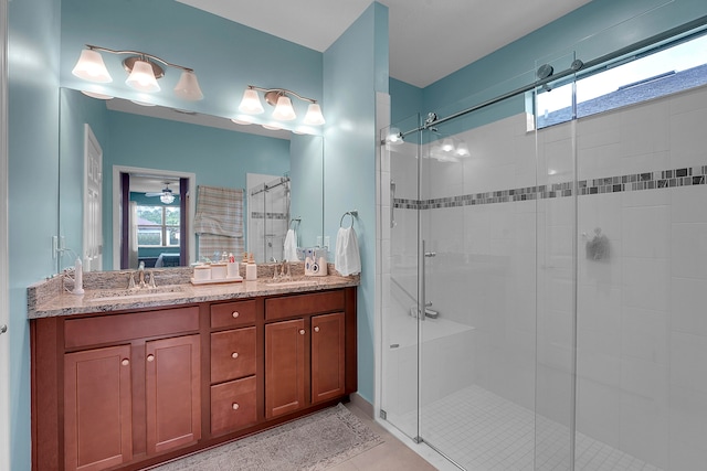 bathroom featuring vanity, tile patterned floors, and a shower with shower door