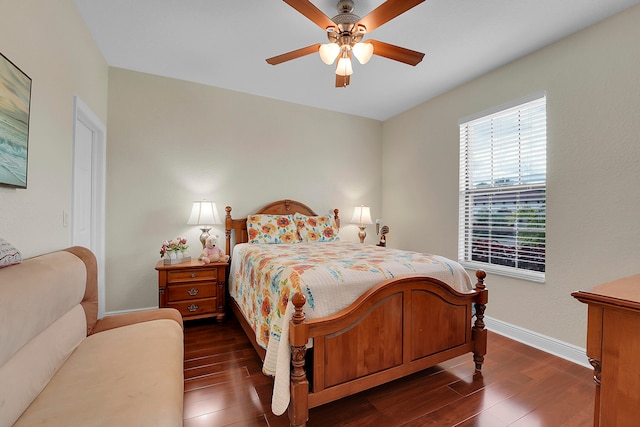 bedroom with ceiling fan and dark wood-type flooring