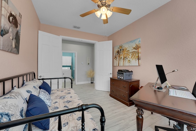 bedroom with light hardwood / wood-style floors and ceiling fan