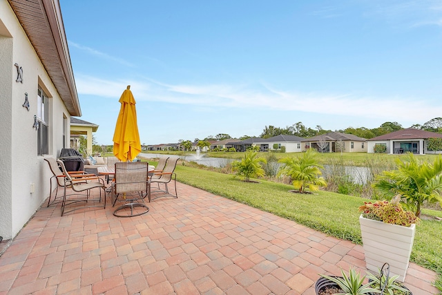 view of patio / terrace with a water view