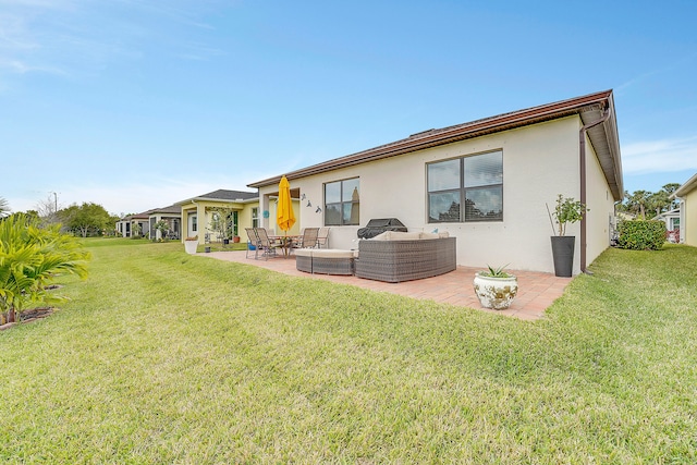 back of property featuring a lawn, an outdoor living space, and a patio