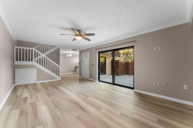 unfurnished living room with ceiling fan, crown molding, and light hardwood / wood-style flooring