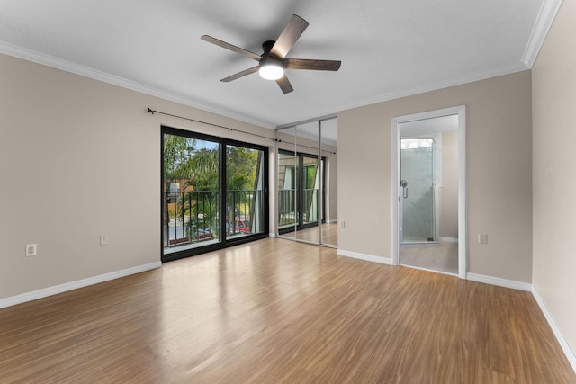 empty room with ornamental molding, ceiling fan, and light hardwood / wood-style floors