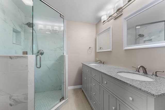 bathroom featuring walk in shower and vanity