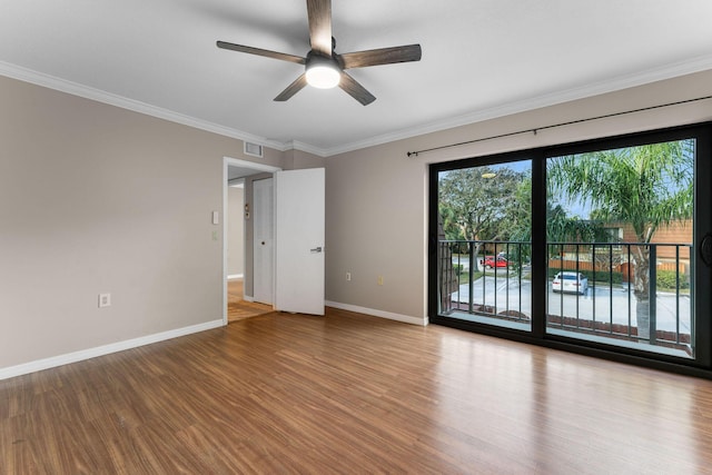 empty room featuring ceiling fan, crown molding, and light hardwood / wood-style floors