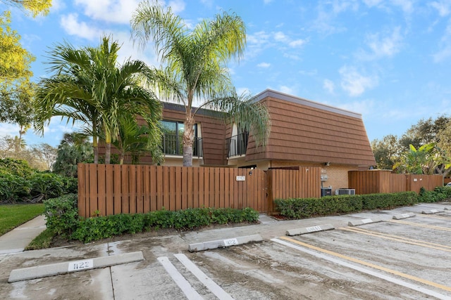 view of side of home featuring central AC