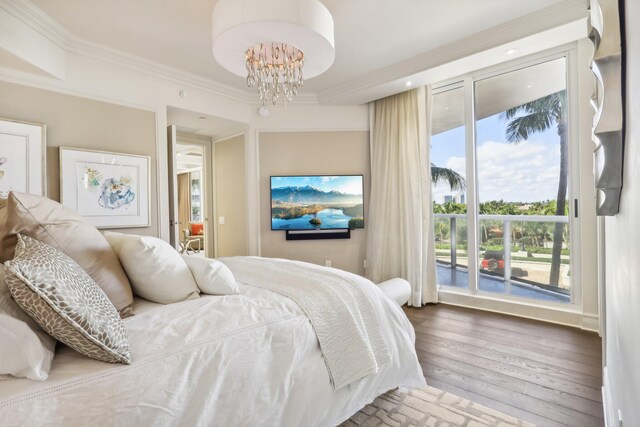 bedroom featuring crown molding, a chandelier, and dark hardwood / wood-style floors