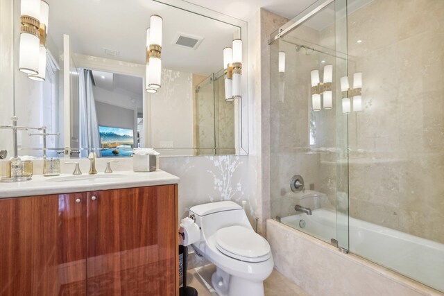 bedroom with a tray ceiling, an inviting chandelier, and crown molding