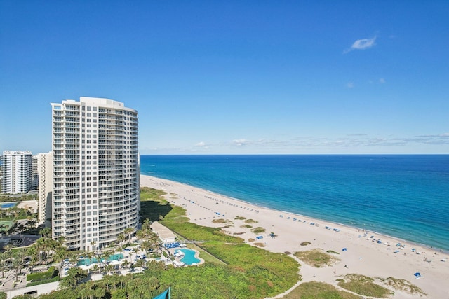 aerial view featuring a view of the beach and a water view