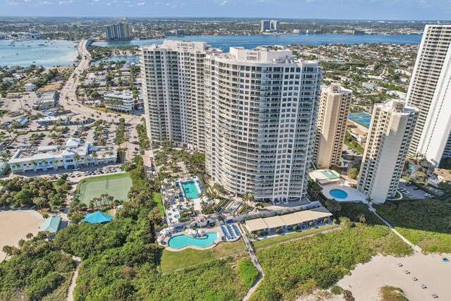 birds eye view of property featuring a view of the beach and a water view