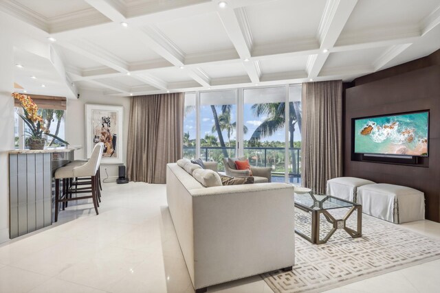 hallway with floor to ceiling windows, beamed ceiling, light tile patterned flooring, and coffered ceiling