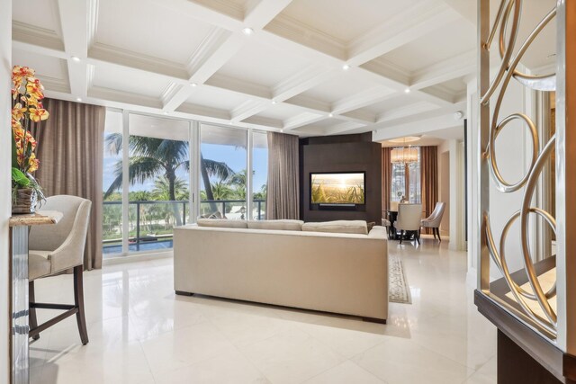 living room with beam ceiling, a wealth of natural light, light tile patterned flooring, and coffered ceiling