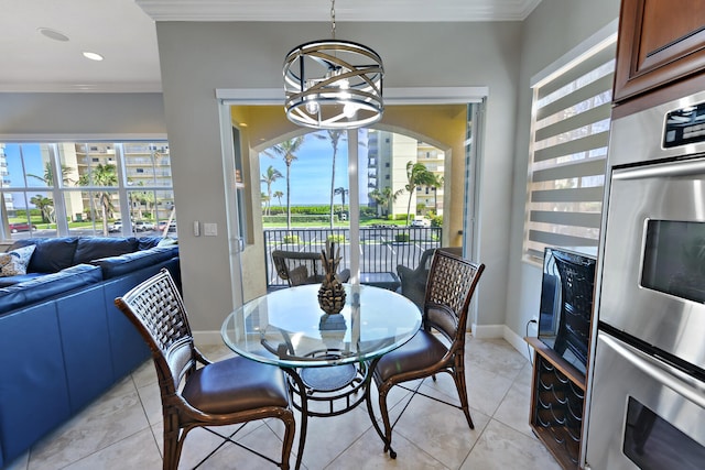 dining space featuring a notable chandelier, light tile patterned flooring, crown molding, and a wealth of natural light